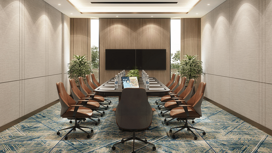Image of a boardroom with a table and chairs around it at Ramada Encore by Wyndham Gurugram Dwarka Expressway